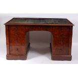 A Victorian figured walnut twin pedestal partner's desk by Gillow of Lancaster, being stamped to top