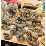 A collection of 11 various Old Country Artist resin figure groups of elephants, the largest height