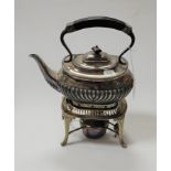 A 20th century silver plated kettle on stand with ebonised handles and half gadrooned body, height