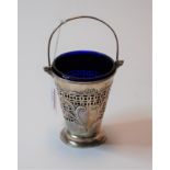 A large late Victorian silver open table salt in the form of a bucket having pierced and floral