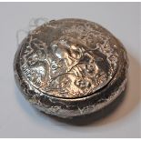 A 19th century Dutch silver pocket snuff box of squat circular form, the hinged lid relief decorated