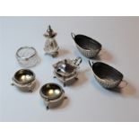 A matched pair of early 20th century silver open salts, each of oval form, with twin handles and