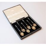 A cased set of six modern silver gilt and enamelled coffee bean spoons, in a Harrod's of London