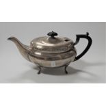 A 20th century silver boat shaped teapot, having an ebonised handle, Sheffield 1933, gross weight 22