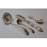 An Edwardian silver sifting spoon, having a pierced shaped circular bowl, with a spirally turned