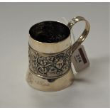 A late Victorian silver christening mug, decorated with Bacchus mask and inscribed 'St Thomas 1902',