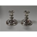 A pair of 20th century Mappin & Webb silver plated dwarf candlesticks, having gadrooned