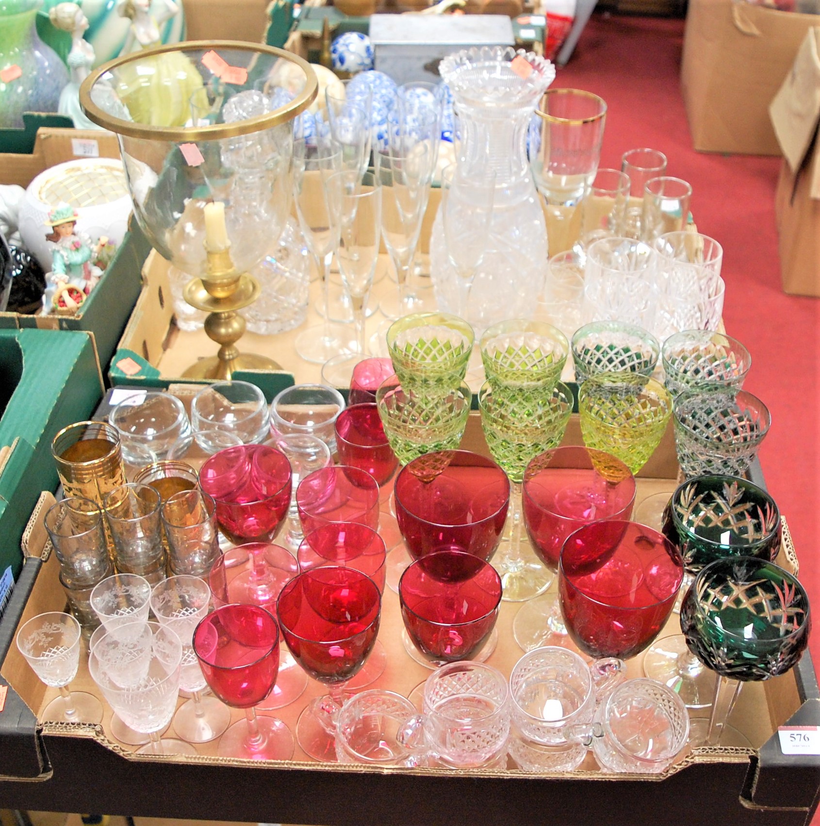 Two boxes of mixed glass ware to include cranberry and hock glasses