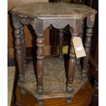 An early 20th century line carved oak octagonal two-tier occasional table, width 58.5cm