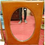 An ebonised gilt decorated and tan leather clad wall mirror, framed as an oval, 119 x 87.5cm