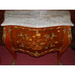 A Louis XV style walnut floral marquetry inlaid and further gilt metal mounted two drawer commode,