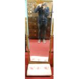 An Art Deco limed walnut and inlaid bevelled rectangular cheval mirror having padded base, width