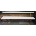 A cream painted and gilt cast iron ended long waiting room bench, length 216cm
