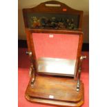 A Victorian mahogany swing toilet mirror together with an oak framed and woolwork inset fire