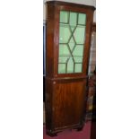A 19th century mahogany freestanding corner cupboard, having astragal glazed upper door, h.213cm