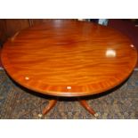 A contemporary mahogany and crossbanded pedestal D-end dining, table having pull-out action and