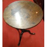 An early 19th century mahogany circular tilt-top pedestal tripod table (currently in two parts),