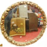 An early 20th century large floral giltwood and gesso circular wall mirror, dia. 97cm