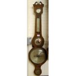 An early 19th century mahogany and satinwood strung four dial wheel barometer, the lower silvered