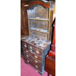 A narrow antique joined dresser, having two tier open plate rack over base fitted with multiple