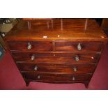 An early 20th century mahogany chest of two short over three long drawers, raised on outswept