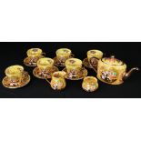 A china tea set with gypsy scene decoration, comprising teapot, milk jug, sugar bowl, six dinner