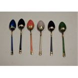 A set of six continental silver gilt and enamelled coffee spoons