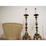 A pair of large turned brass table lamps each having a knopped and turned column to triform base