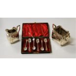 A cased set of six silver teaspoons each having bright cut engraved decoration together with