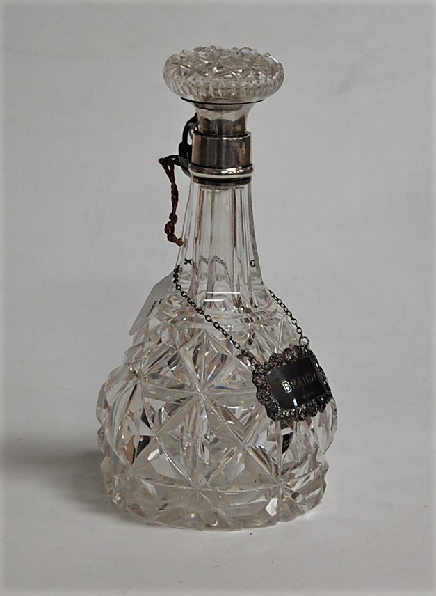 A cut glass mallet decanter and stopper, having silver collar and padlock; together with a silver