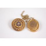 A 9ct gold front and back engraved oval picture locket, on gilt metal finelink neck chain;