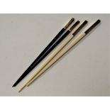 A pair of Christoffel ebony and white metal mounted chop sticks together with one other pair (2)