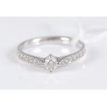 A 14ct white gold diamond ring, the central round brilliant cut diamond, estimated approx. 0.