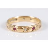 An 18ct gold eternity ring, 'gypsy' set with small round cut alternating rubies and diamonds, 3.