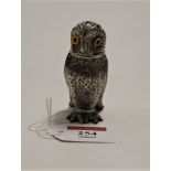 A novelty silver plated pepperette, in the form of an owl with glass eyes and removable head, h.7cm