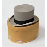 An early 20th century grey felt top hat bearing a label for B Lipman Ltd Man's Store, Oxford Street,