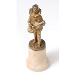 An Art Deco gilt bronze miniature figure of Pierrot, in typical standing pose playing a mandolin,