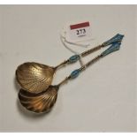A pair of early 20th century continental white metal, blue enamelled and filigree worked spoons,