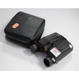 A pair of Nikon 9x25 field binoculars, cased