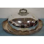 A large Victorian silver plated cloche having a cast leaf and berry handle and gadrooned rim,