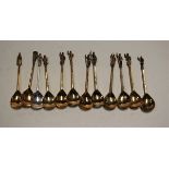 A set of 11 modern silver gilt apostle spoons together with one other matching silver example, maker