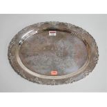 A Far Eastern sterling silver presentation plate, with engraved inscription and cast rim, made for