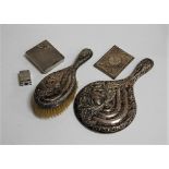 A silver backed hairbrush and a hand mirror; together with a NAAFI Stores cigarette case; a filigree