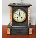 A late Victorian black slate and rouge marble cased mantel clock having an enamel dial with Arabic