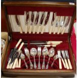 A mid-20th century walnut cased cutlery canteen and contents