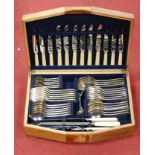 A mid-20th century oak cased cutlery canteen and contents