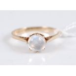 A 9ct gold moonstone ring, the round moonstone cabochon, approx. 6.4mm diameter, claw mounted to a