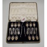 A cased set of 12 Edwardian silver teaspoons, each having an engraved bowl with floral openwork