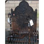 A cast iron fireback, together with a grate and pair of fire dogs (4)