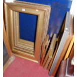 A collection of medium and small gilt rectangular picture frames